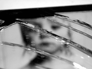 Child Showing Through Broken Glass